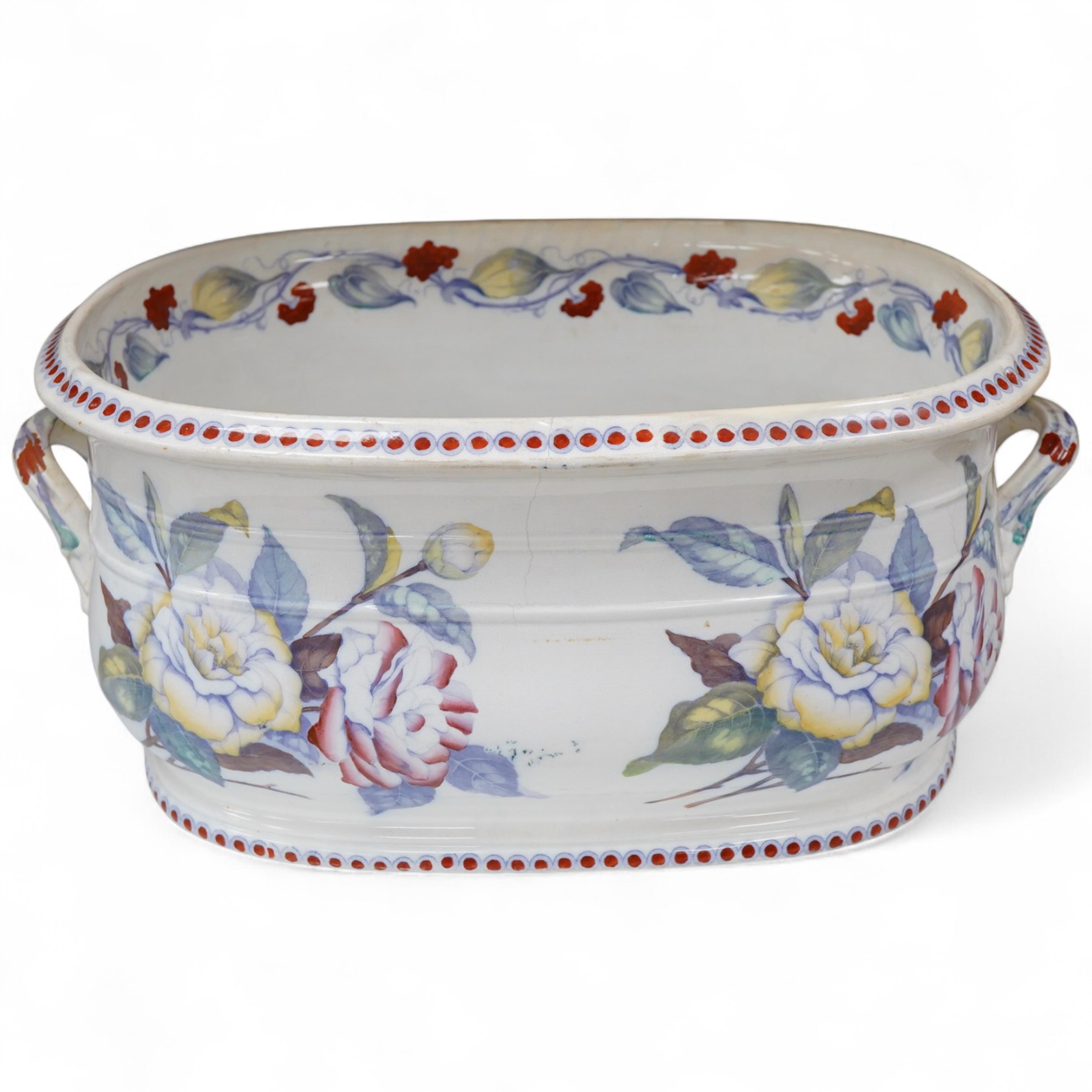 A 19th century Staffordshire pottery two handled footbath, (repaired), 50cm wide